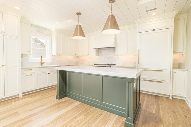 146 22nd St, Avalon, NJ 08202 - kitchen featuring light countertops, light wood-style flooring, custom exhaust hood, tasteful backsplash, and wooden ceiling