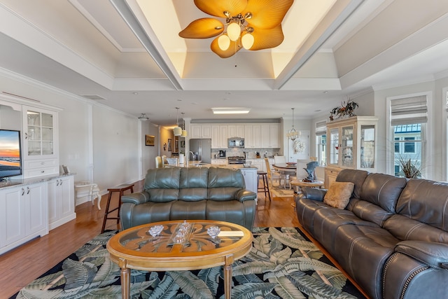 3401 Seaboard Cir Unit 3401, North Wildwood, NJ 08260 - living area featuring dark wood-style flooring, a ceiling fan, and ornamental molding