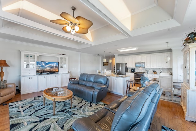 3401 Seaboard Cir Unit 3401, North Wildwood, NJ 08260 - living area with crown molding, ceiling fan, and light wood-type flooring