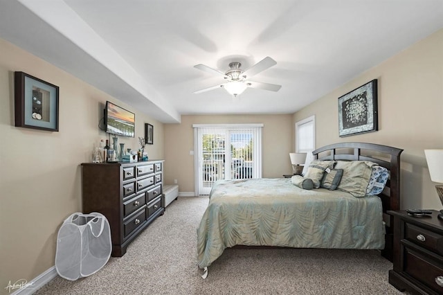 bedroom featuring access to outside, light colored carpet, ceiling fan, and baseboards