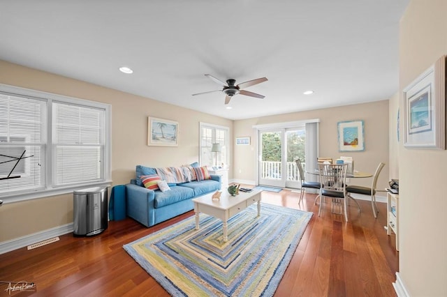 living room featuring baseboards, visible vents, ceiling fan, wood finished floors, and recessed lighting