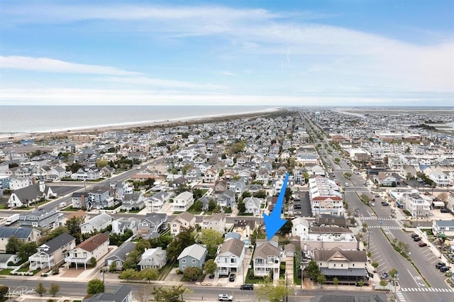 drone / aerial view featuring a water view and a residential view