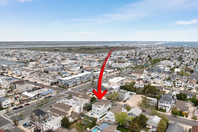 aerial view with a residential view and a water view