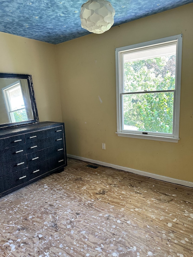 unfurnished bedroom with a textured ceiling