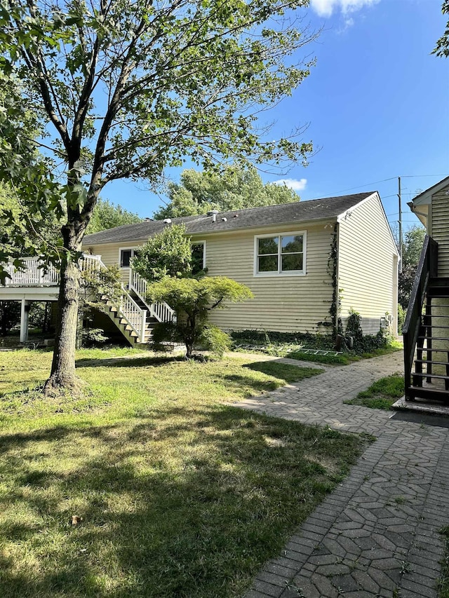 view of yard featuring a wooden deck