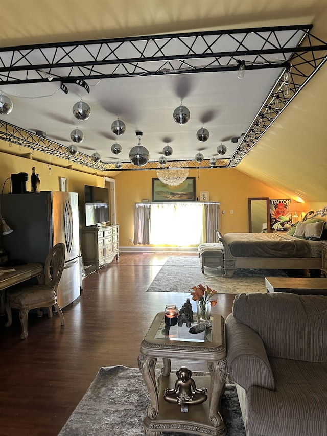 living room featuring wood-type flooring and lofted ceiling