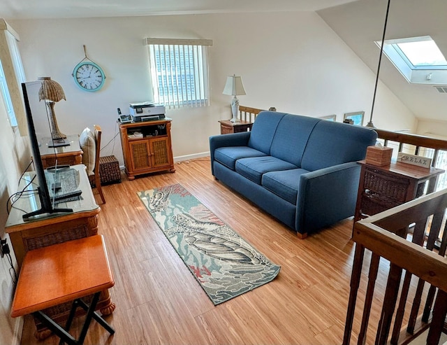 living room featuring lofted ceiling with skylight and hardwood / wood-style flooring