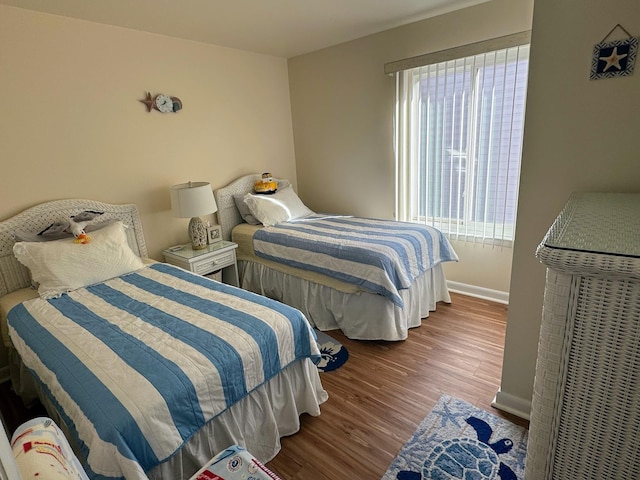 bedroom featuring wood-type flooring