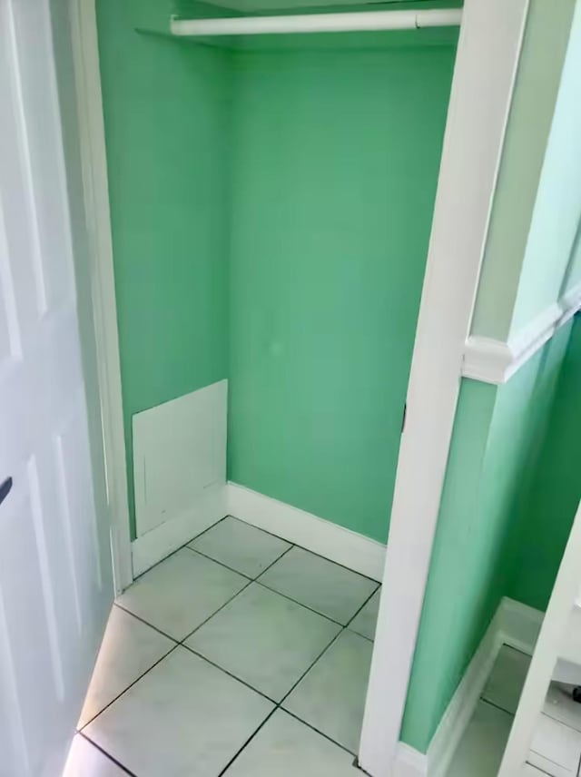 bathroom with tile patterned floors