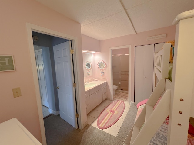 bathroom featuring vanity, toilet, and a shower with shower door