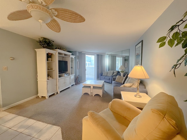 carpeted living room featuring ceiling fan