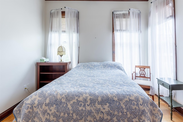 bedroom with light wood-type flooring