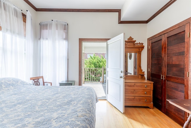 bedroom featuring access to exterior, light wood-type flooring, and ornamental molding