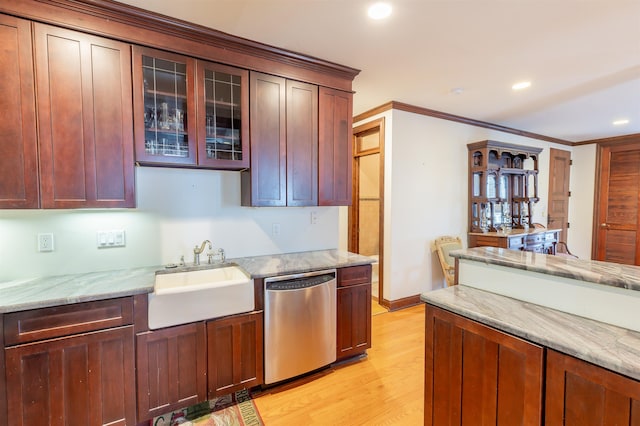 kitchen featuring sink, light hardwood / wood-style flooring, stainless steel dishwasher, ornamental molding, and light stone counters