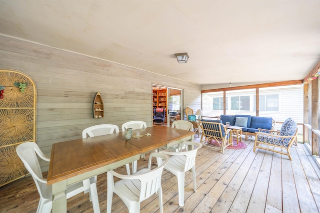 408 Princeton Ave, Cape May Point, NJ 08212 - dining room featuring light wood-type flooring and wooden walls