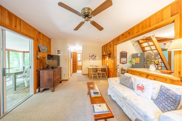 408 Princeton Ave, Cape May Point, NJ 08212 - living room featuring wooden walls, light carpet, and a ceiling fan