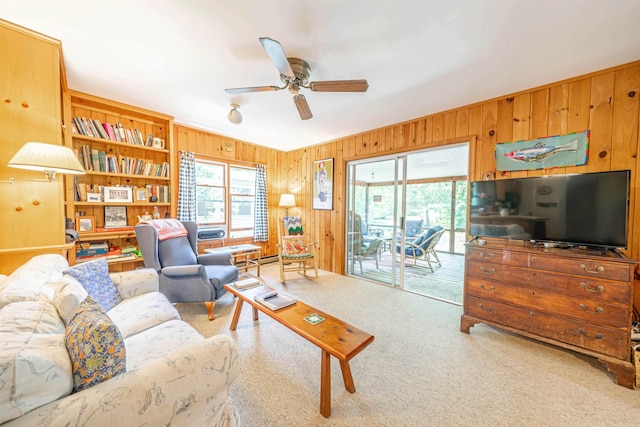 408 Princeton Ave, Cape May Point, NJ 08212 - living room featuring wood walls, a ceiling fan, and carpet