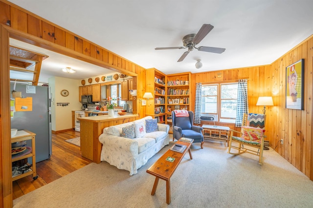 408 Princeton Ave, Cape May Point, NJ 08212 - living area with wooden walls, a ceiling fan, and wood finished floors