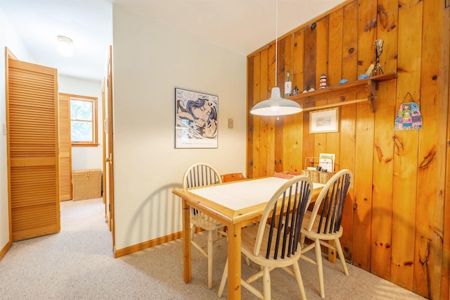 408 Princeton Ave, Cape May Point, NJ 08212 - carpeted dining room featuring wood walls and baseboards