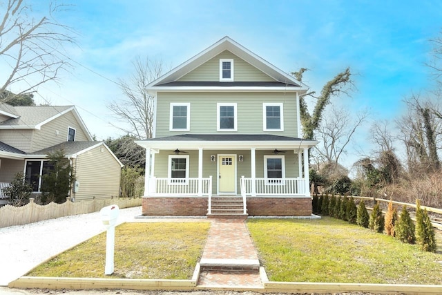 view of front of home with covered porch and a front yard