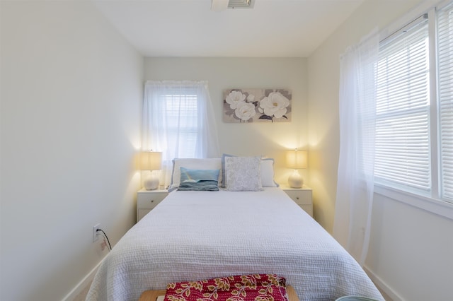 bedroom featuring baseboards