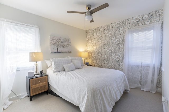 carpeted bedroom with a ceiling fan