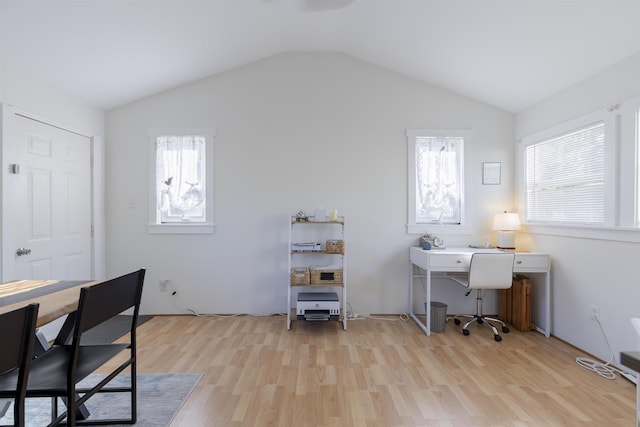 office area featuring vaulted ceiling and light wood-style floors