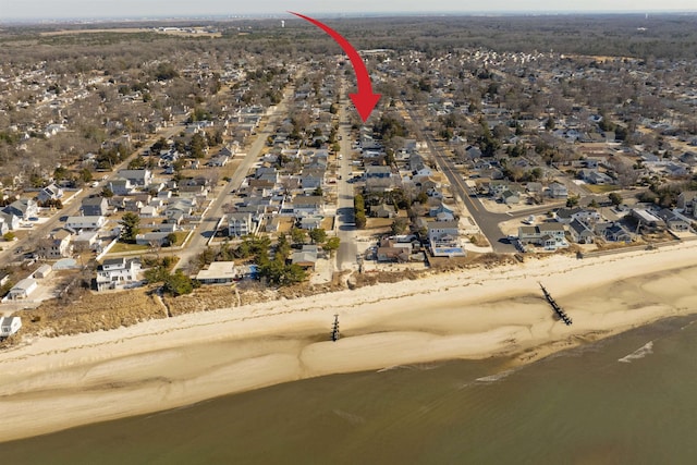 aerial view with a residential view and a view of the beach