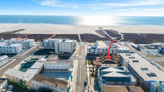 bird's eye view featuring a beach view and a water view