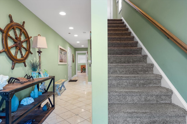 stairs featuring tile patterned floors