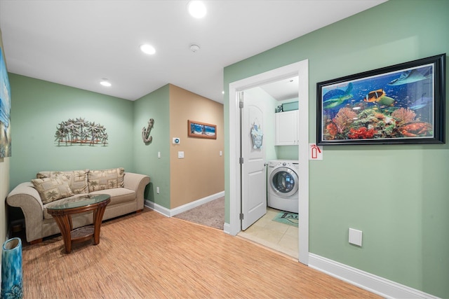 interior space with washer / dryer and light wood-type flooring