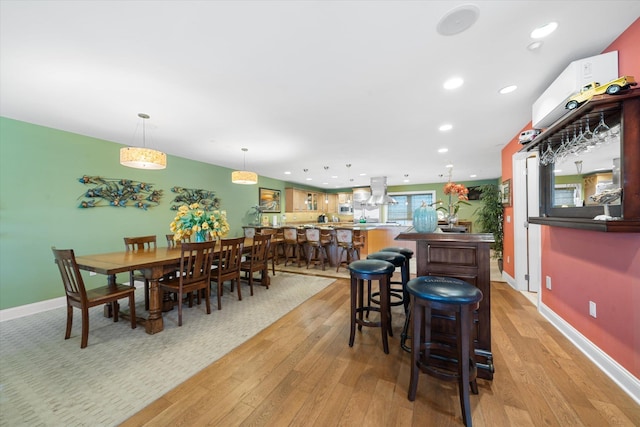 dining area with light hardwood / wood-style flooring