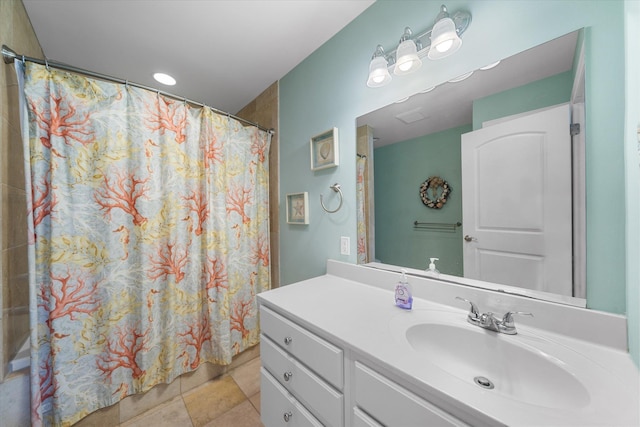 bathroom with a shower with shower curtain, vanity, and tile patterned floors