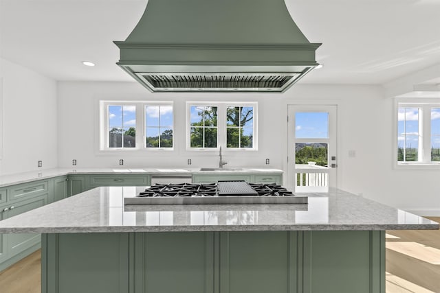 9 N 8th St, Del Haven, NJ 08251 - kitchen with green cabinetry, custom range hood, plenty of natural light, stainless steel gas stovetop, and recessed lighting