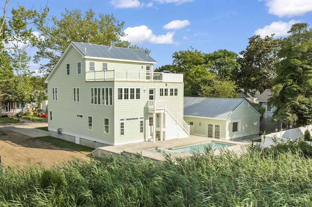 9 N 8th St, Del Haven, NJ 08251 - rear view of house featuring a balcony, stairway, a metal roof, and french doors