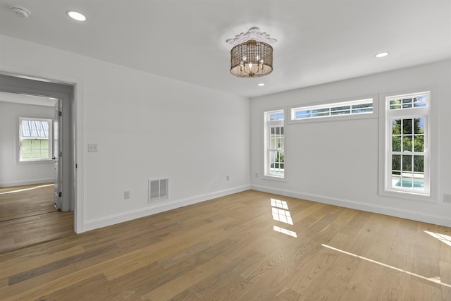 9 N 8th St, Del Haven, NJ 08251 - empty room featuring a smoke detector, wood finished floors, a chandelier, and recessed lighting