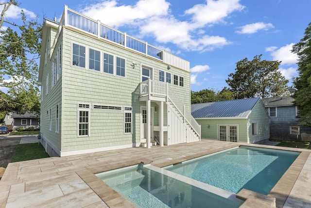 9 N 8th St, Del Haven, NJ 08251 - back of house with a patio, a balcony, a pool with connected hot tub, and stairs