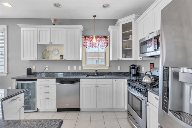 240 E Taylor Ave Unit 100, Wildwood, NJ 08260 - kitchen featuring stainless steel appliances, wine cooler, light tile patterned flooring, a chandelier, and recessed lighting