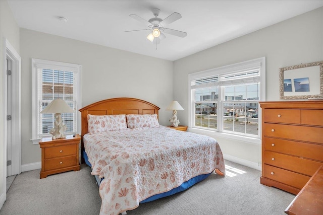 240 E Taylor Ave Unit 100, Wildwood, NJ 08260 - bedroom with light colored carpet, multiple windows, and ceiling fan