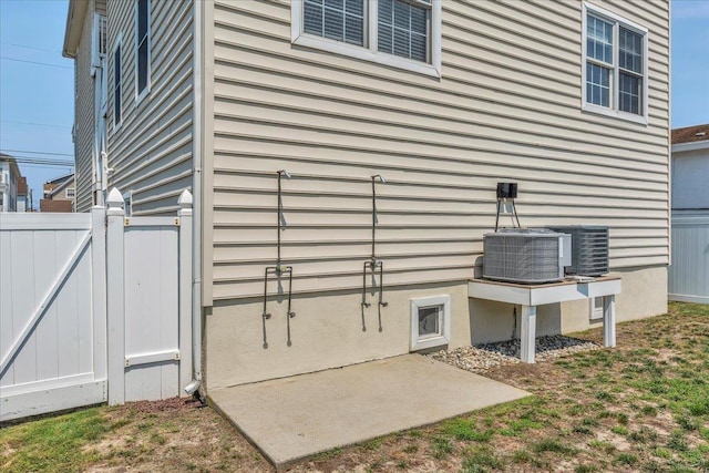 240 E Taylor Ave Unit 100, Wildwood, NJ 08260 - view of property exterior with a gate and a central air condition unit