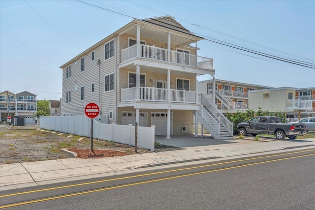 240 E Taylor Ave Unit 100, Wildwood, NJ 08260 - view of front of property with an attached garage, stairway, and a balcony