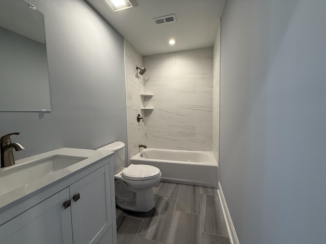 bathroom with visible vents, shower / bath combination, vanity, and toilet