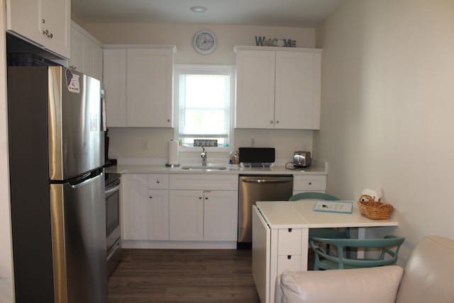 kitchen with white cabinetry, sink, and stainless steel appliances