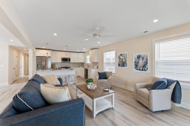 120 W 1st Ave Unit 1, North Wildwood, NJ 08260 - living area with light wood-type flooring, ceiling fan, and recessed lighting