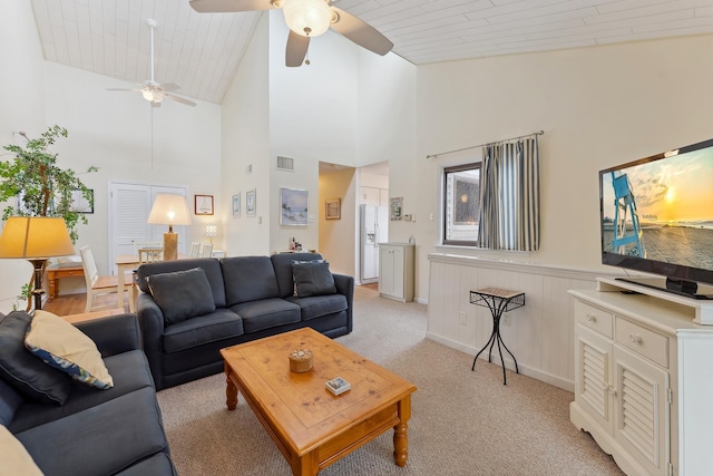 living room featuring light carpet, high vaulted ceiling, wood ceiling, and ceiling fan