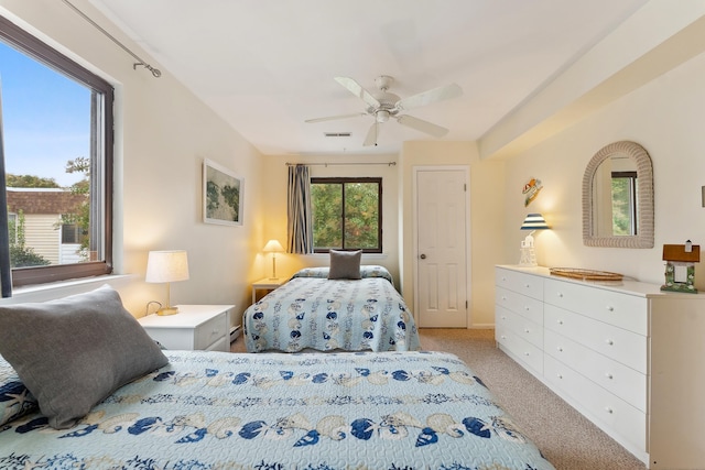 carpeted bedroom featuring ceiling fan