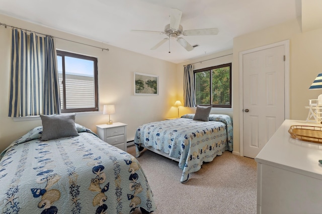 bedroom with ceiling fan and light colored carpet