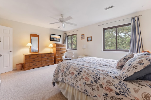 bedroom featuring ceiling fan and carpet