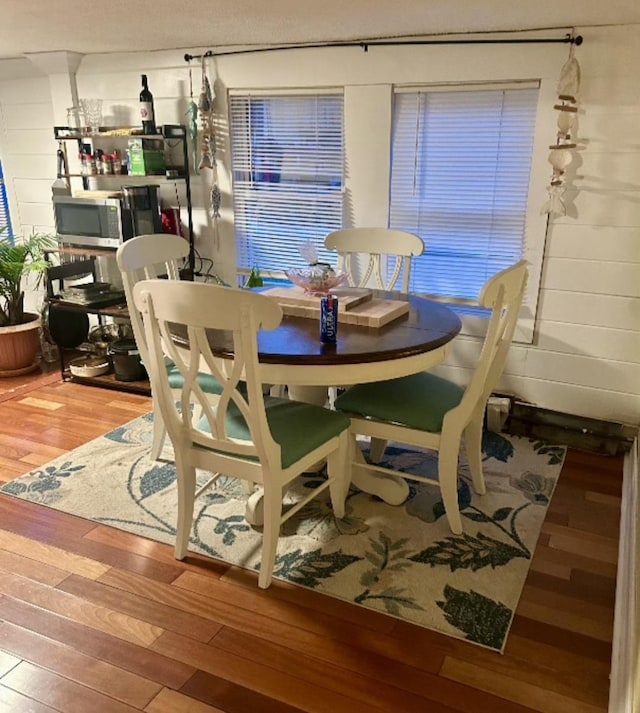 dining area featuring hardwood / wood-style flooring