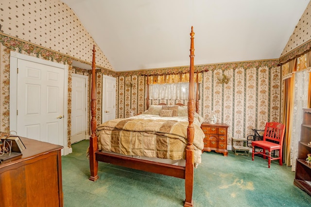 carpeted bedroom with lofted ceiling and wallpapered walls